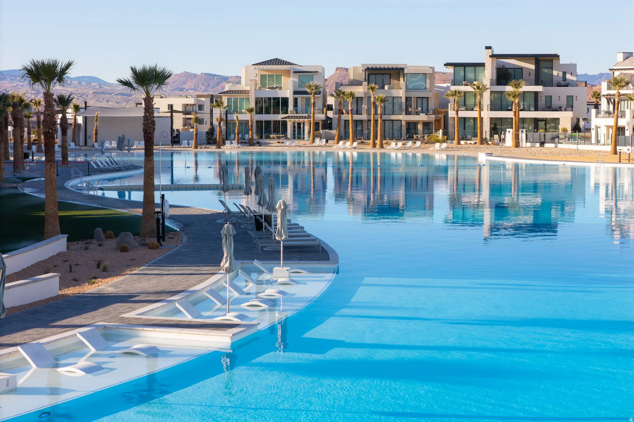 Community pool featuring a patio area and a residential view
