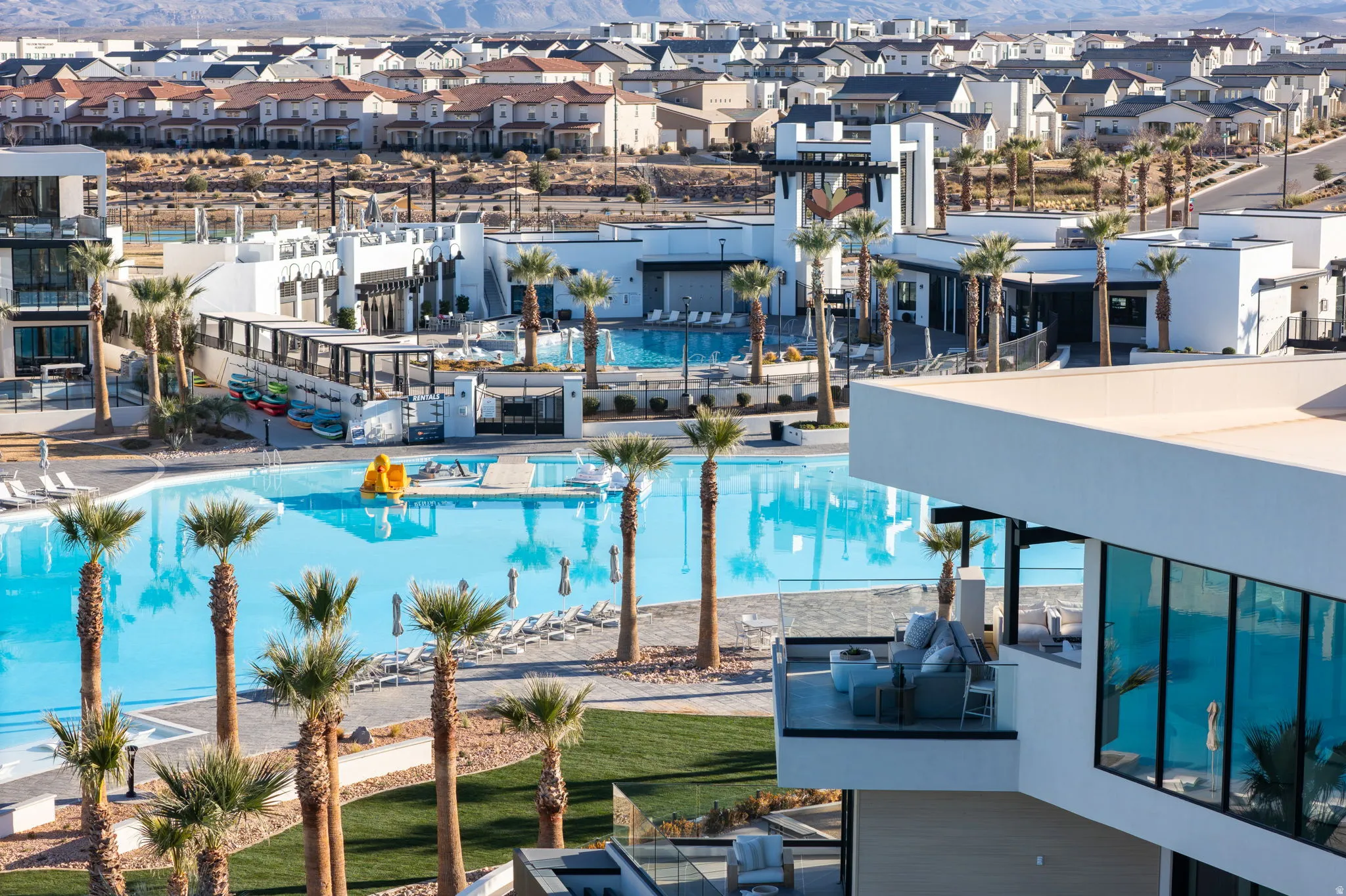 Community pool with a patio