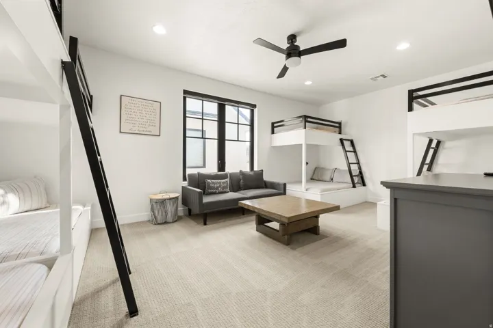 Bedroom featuring light carpet, recessed lighting, and ceiling fan