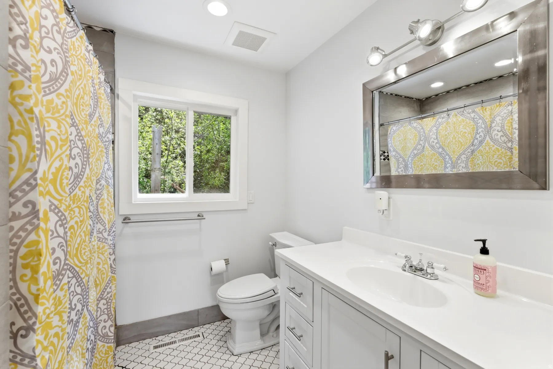 Bathroom with vanity, a shower with shower curtain, light tile patterned flooring, and recessed lighting