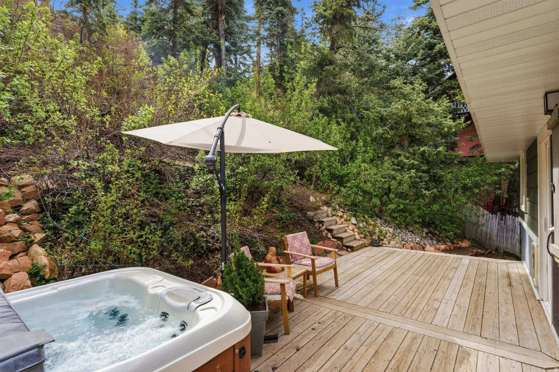 Wooden terrace with a hot tub