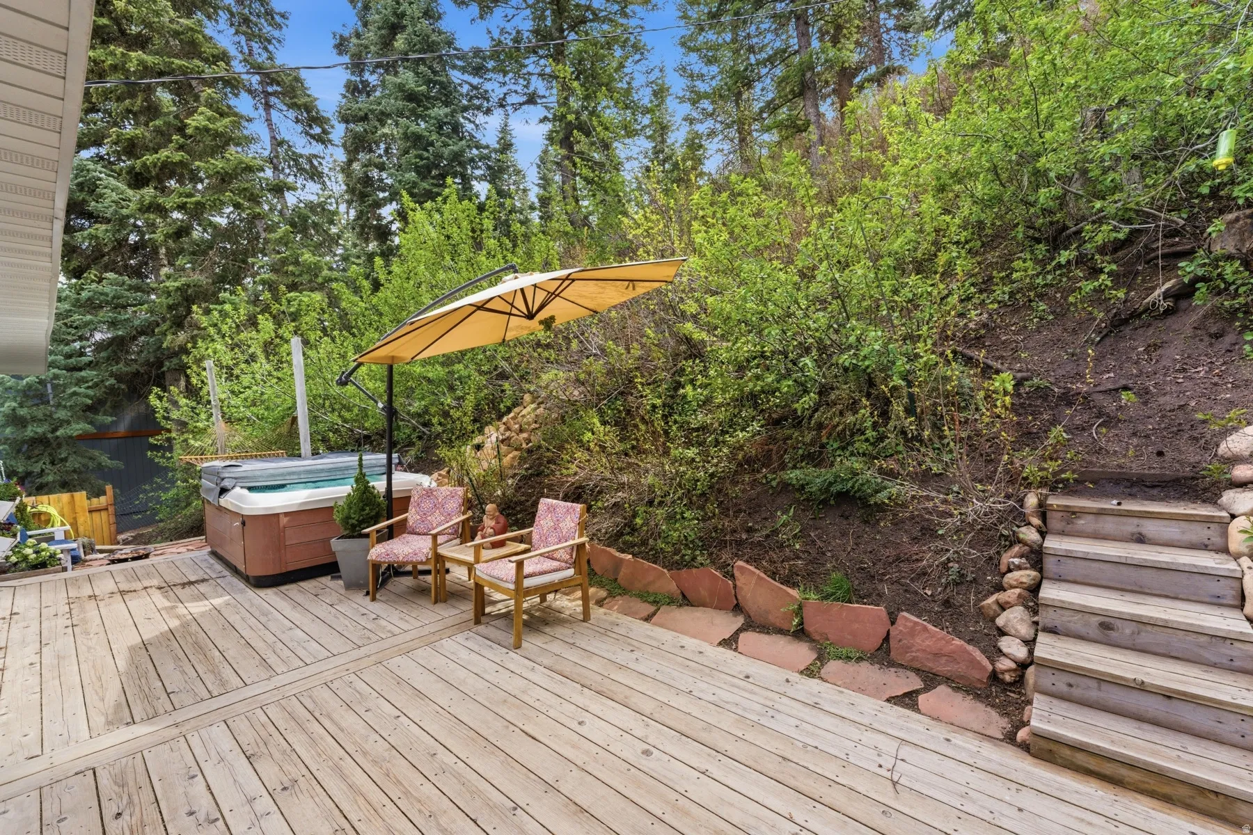 Wooden deck with a hot tub