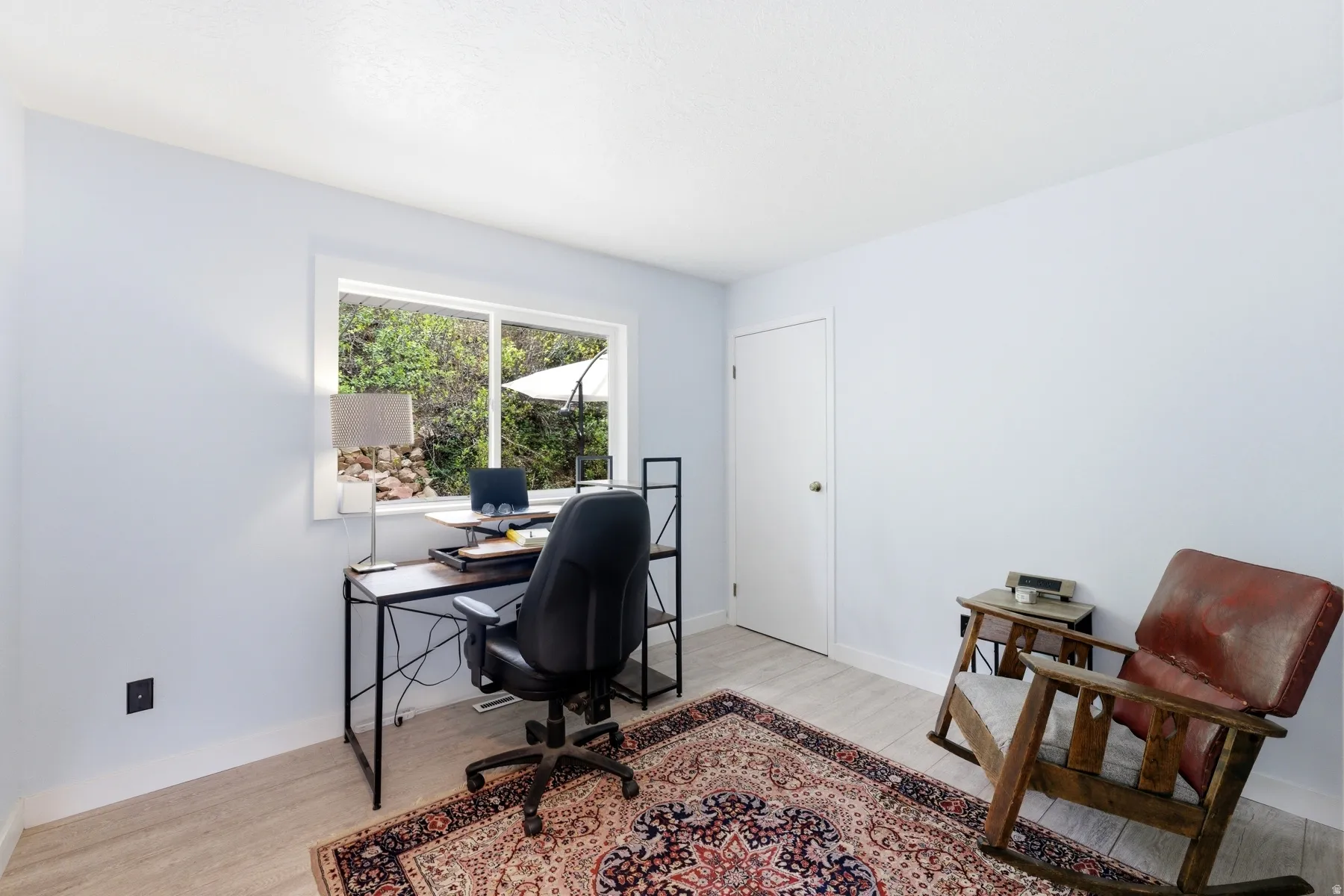 Office with light wood finished floors and baseboards