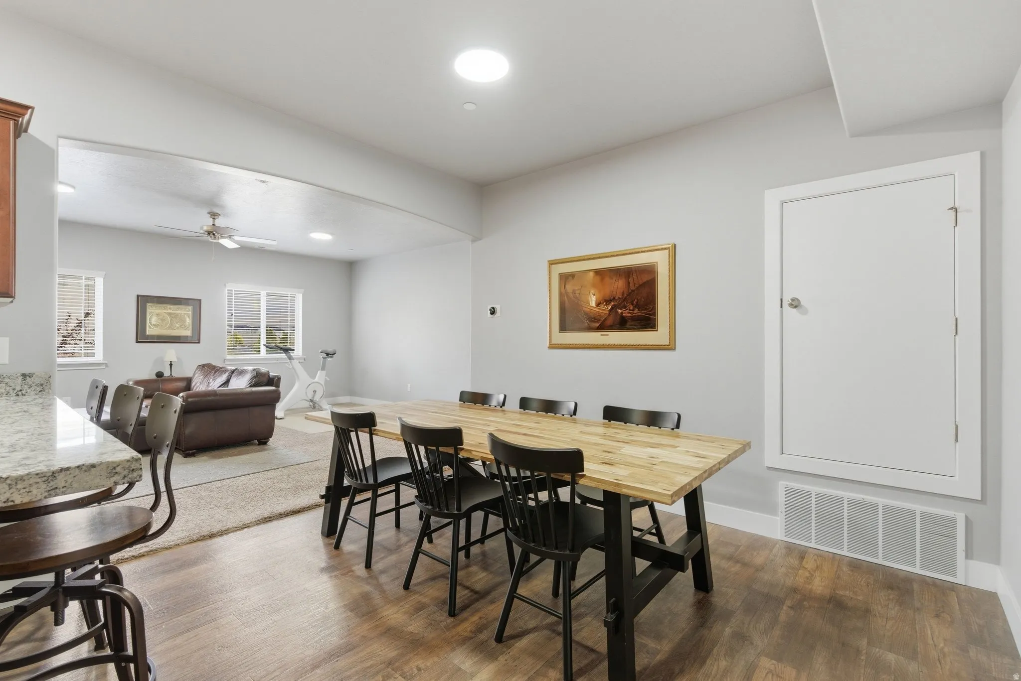 Dining space featuring a ceiling fan, dark wood-style flooring, and recessed lighting