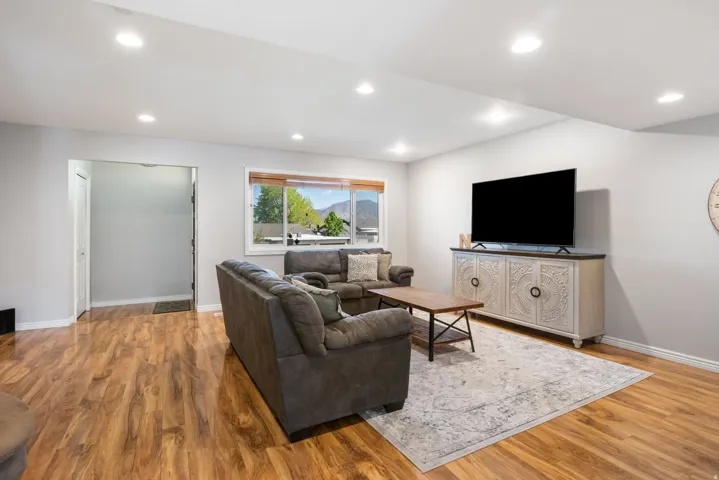 Living room featuring light wood-type flooring and recessed lighting