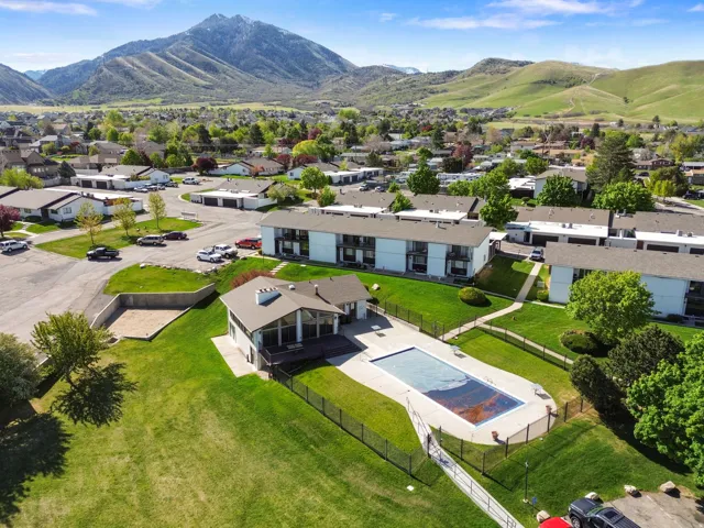 Aerial perspective of suburban area featuring a mountainous background