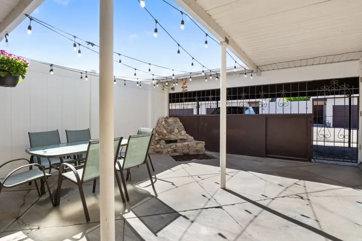 View of patio / terrace with outdoor dining space and a gate