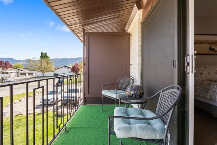 Balcony featuring a mountain view and a residential view