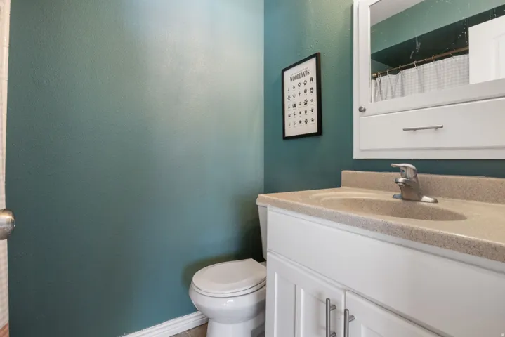 Full bath featuring vanity and a shower with shower curtain