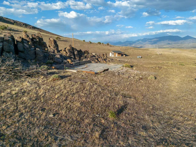 View of mountain backdrop with rural landscape