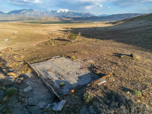 View of mountain background featuring rural landscape