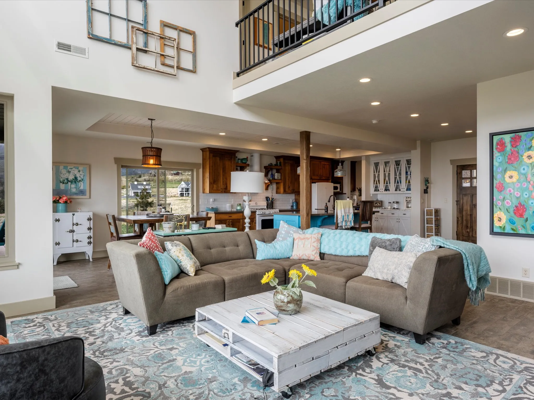 Living area featuring recessed lighting, wood finished floors, and a vaulted  ceiling