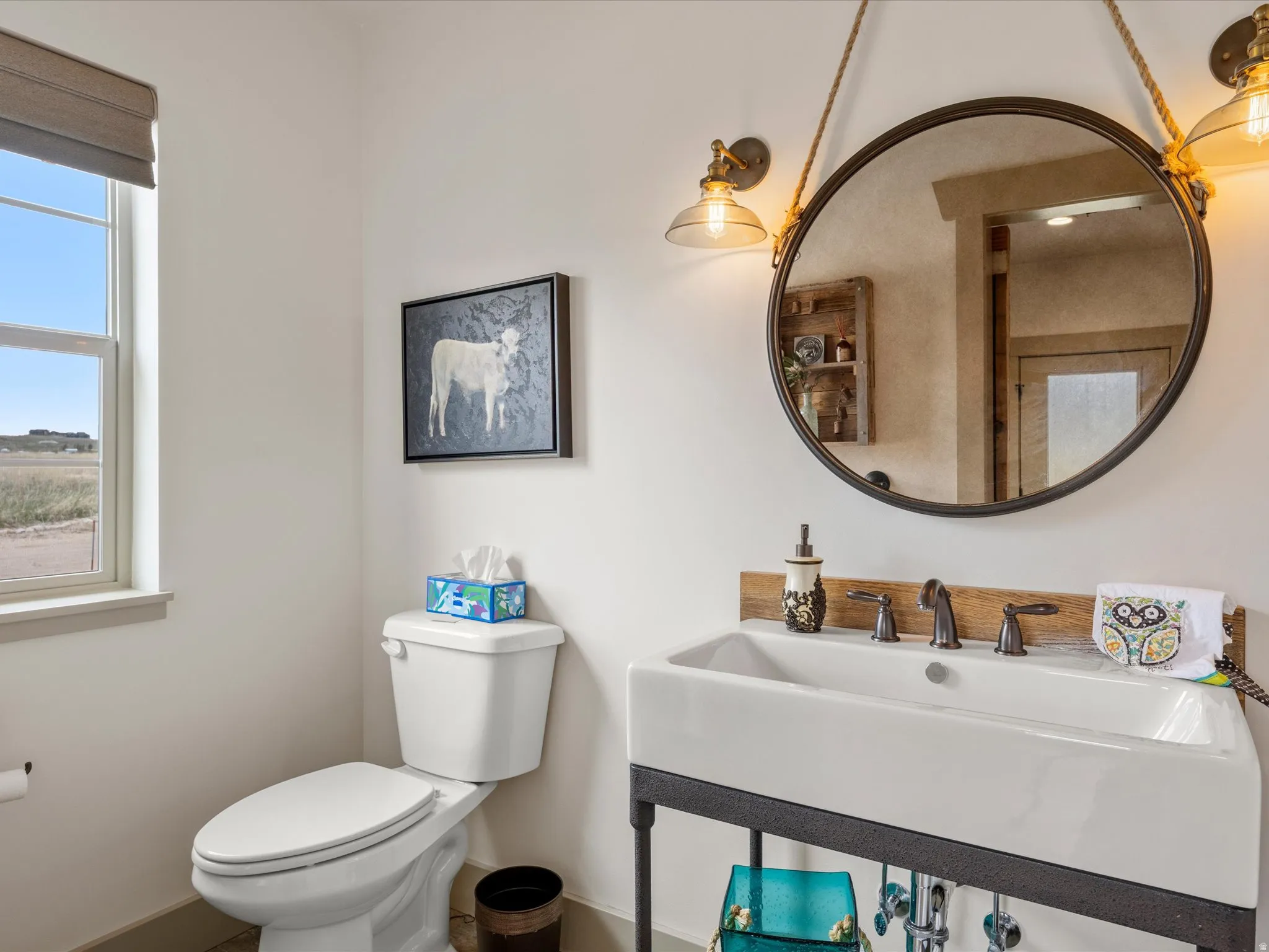 Half bathroom featuring a sink and toilet