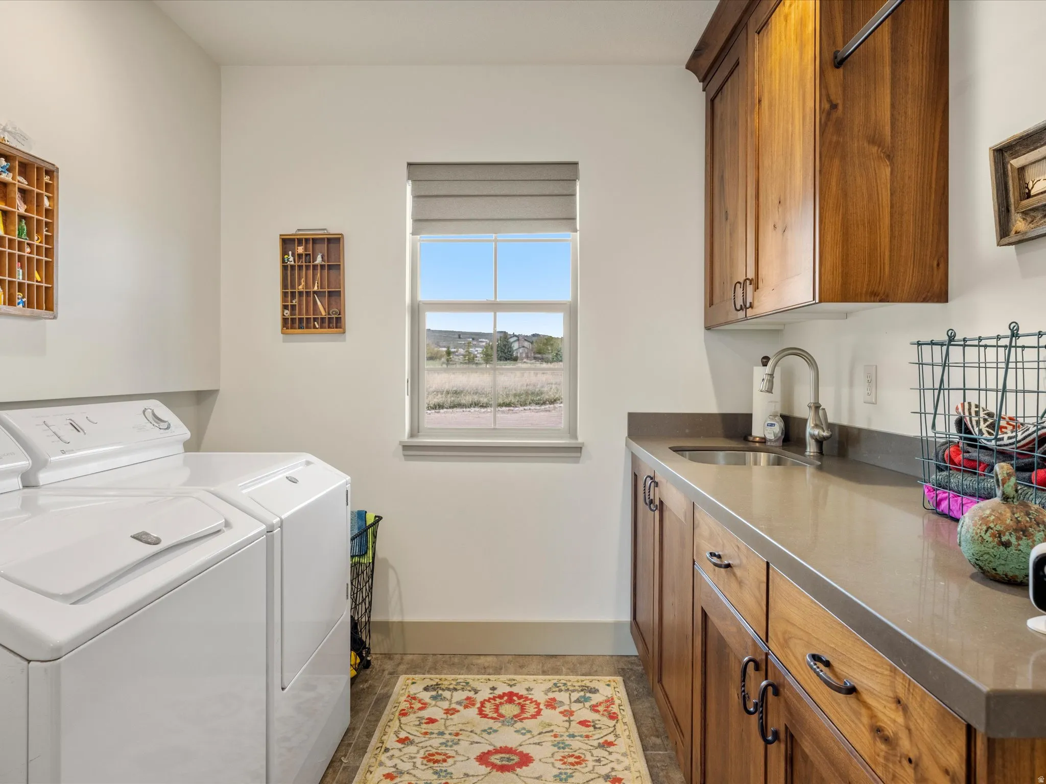 Laundry area with washing machine and clothes dryer and cabinet space