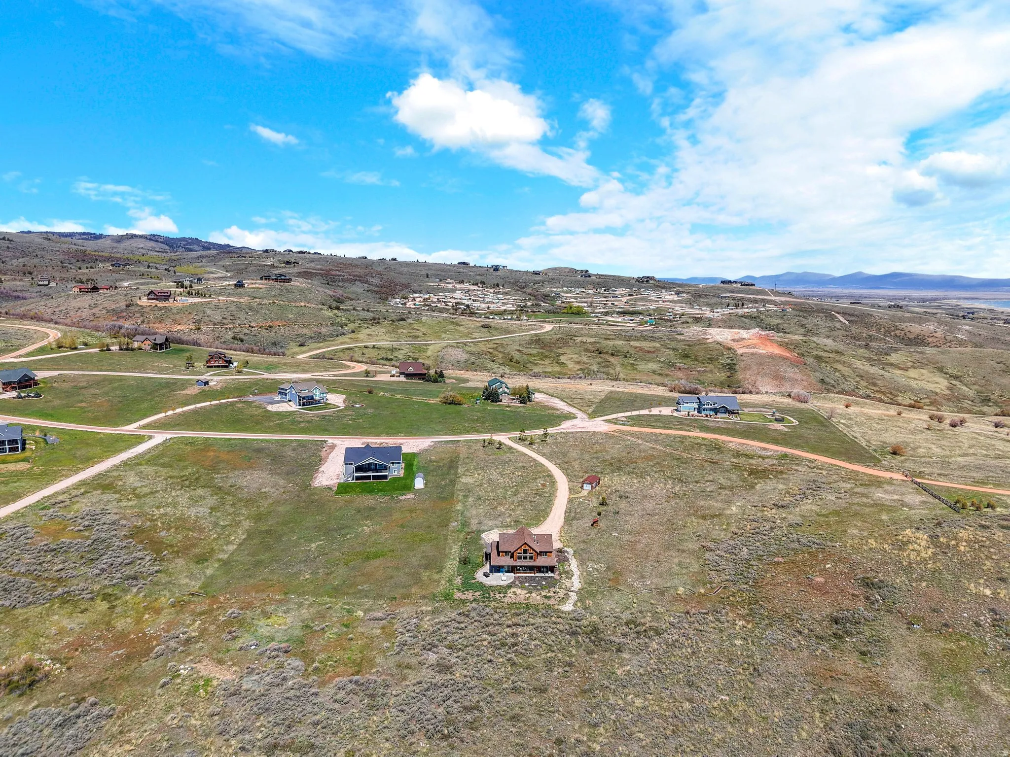 Aerial view of sparsely populated area with a mountain backdrop