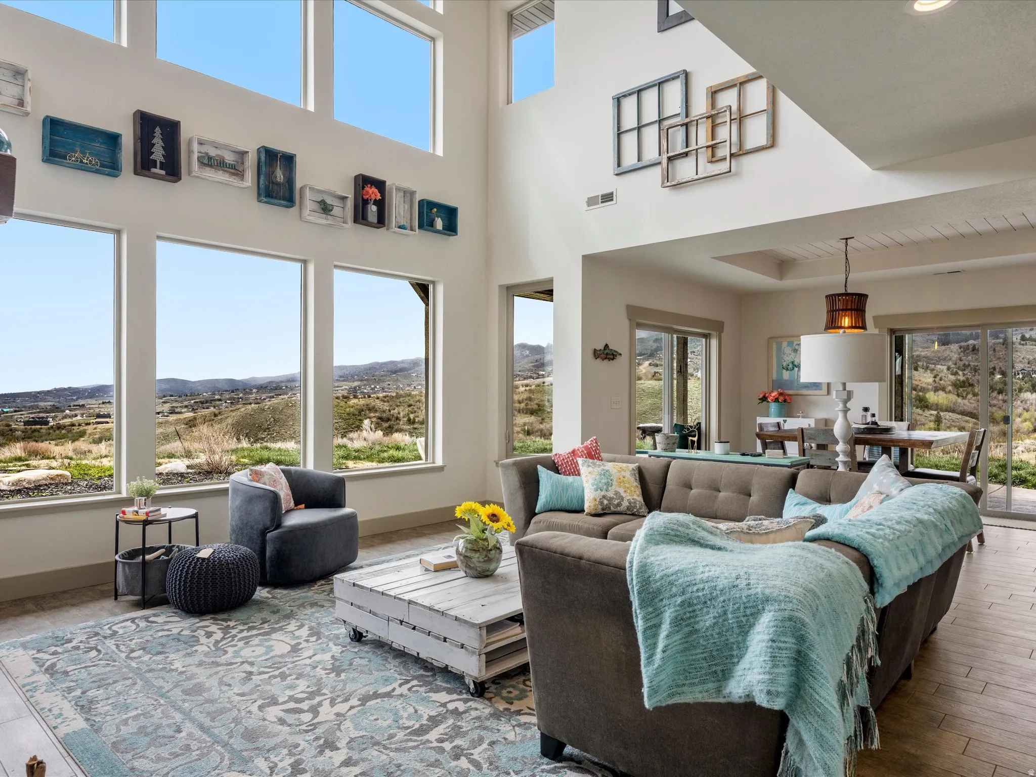 Living room featuring full height windows and a mountain view
