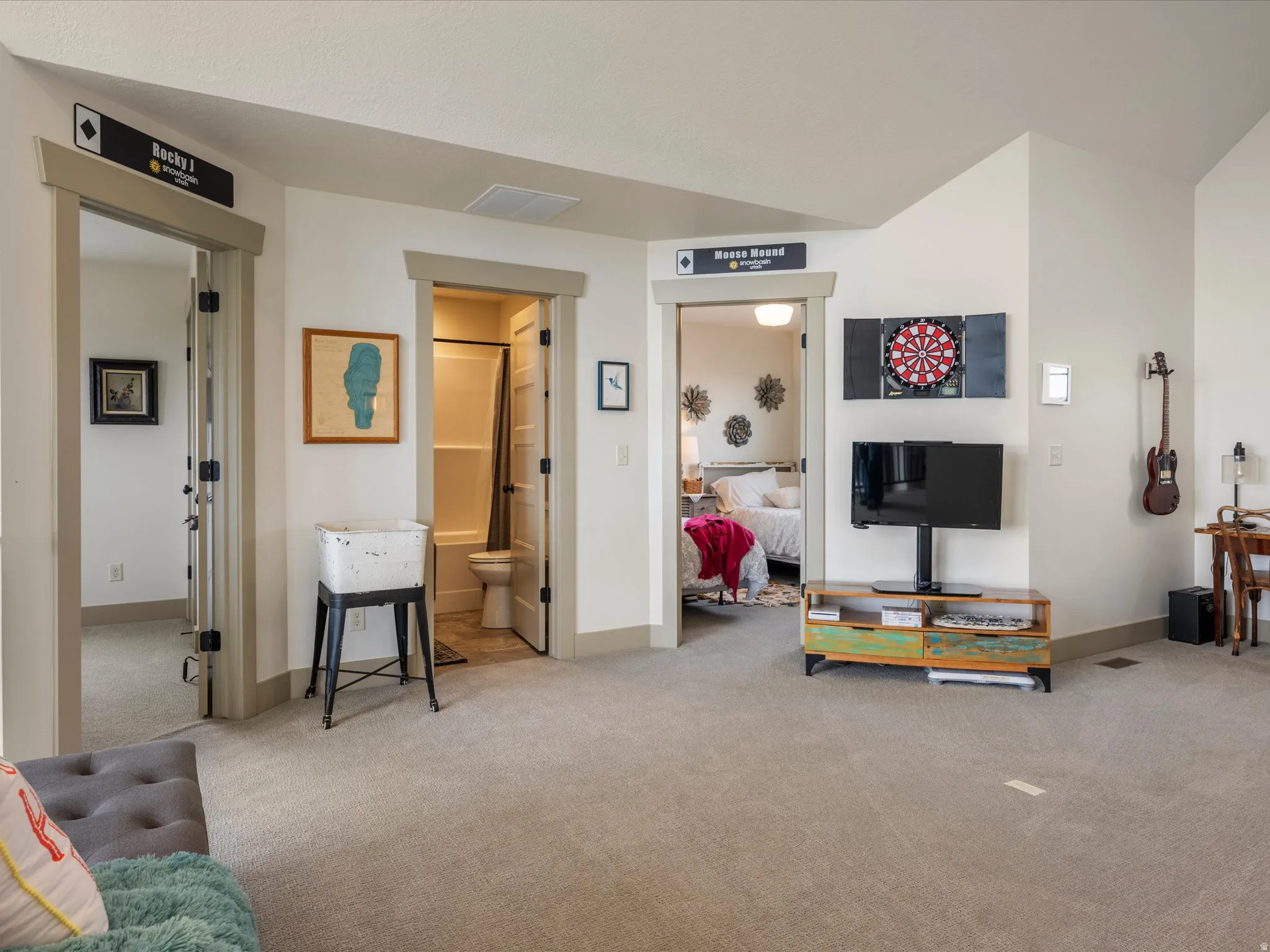 Living area featuring light carpet