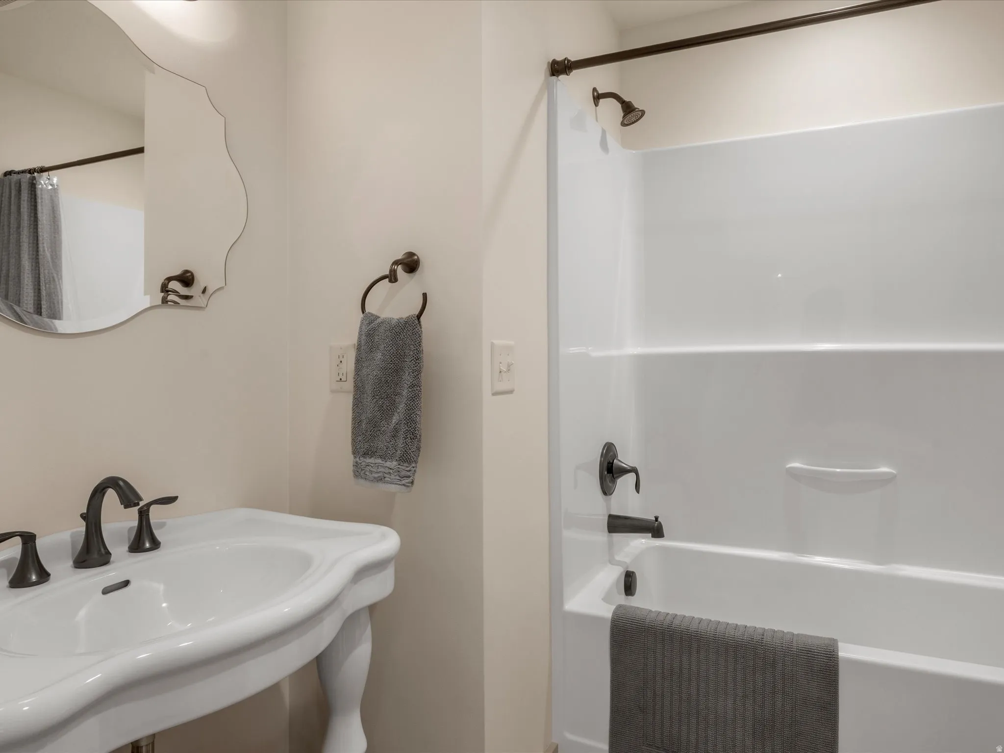 Full bathroom with a sink and shower / tub combination
