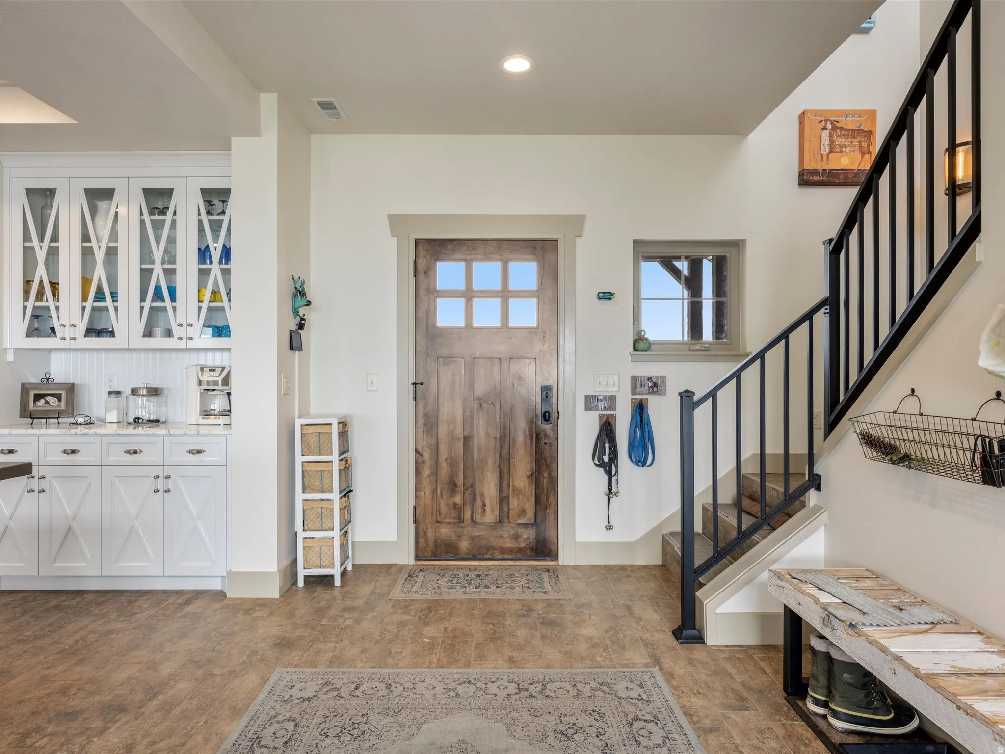 Entrance foyer with dark wood-style floors and recessed lighting