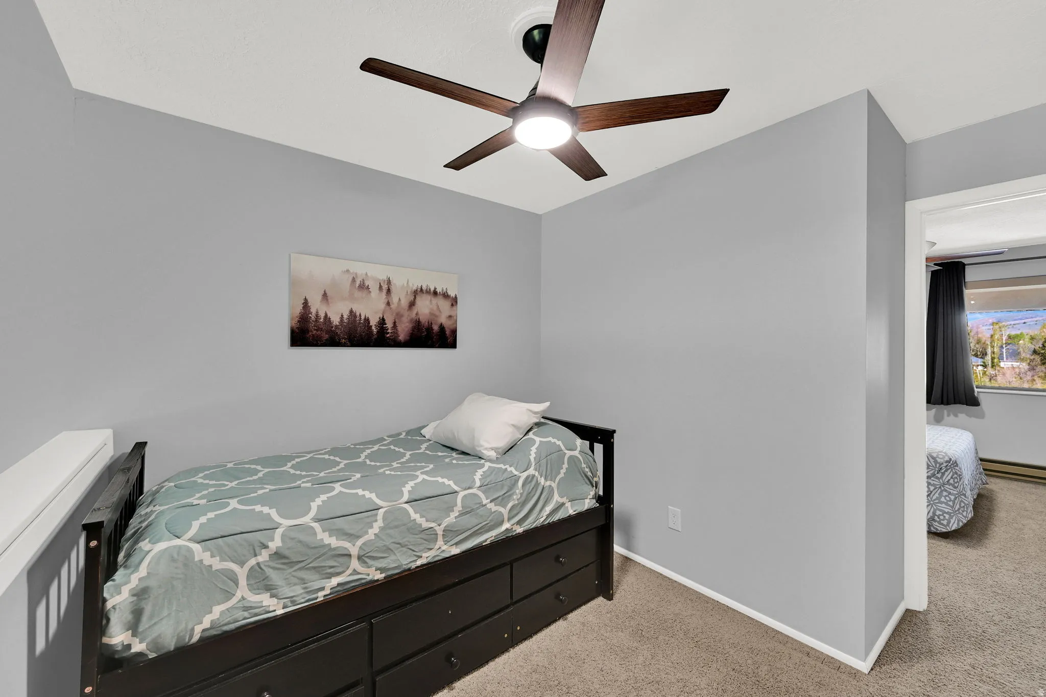 3rd bedroom* in lofted space with trundle bed and direct bathroom access.