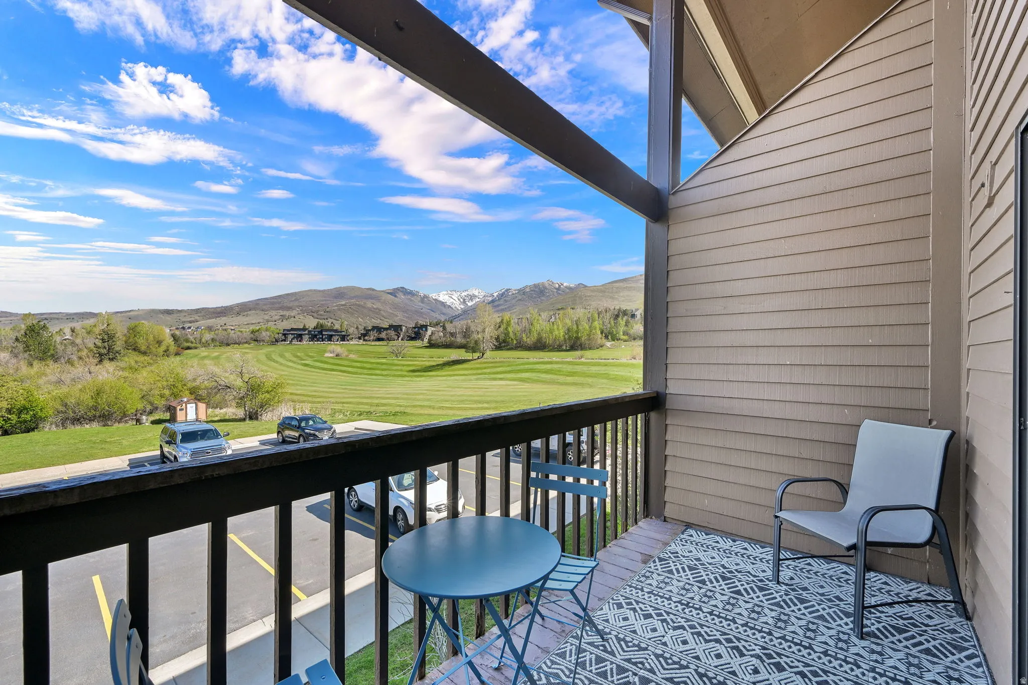 Balcony featuring a mountain view and golf course view