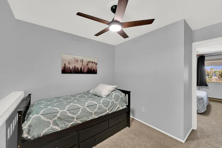 3rd bedroom* in lofted space with trundle bed and direct bathroom access.