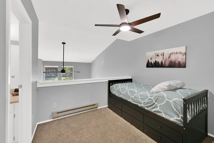 3rd bedroom* in lofted space with trundle bed and direct bathroom access.