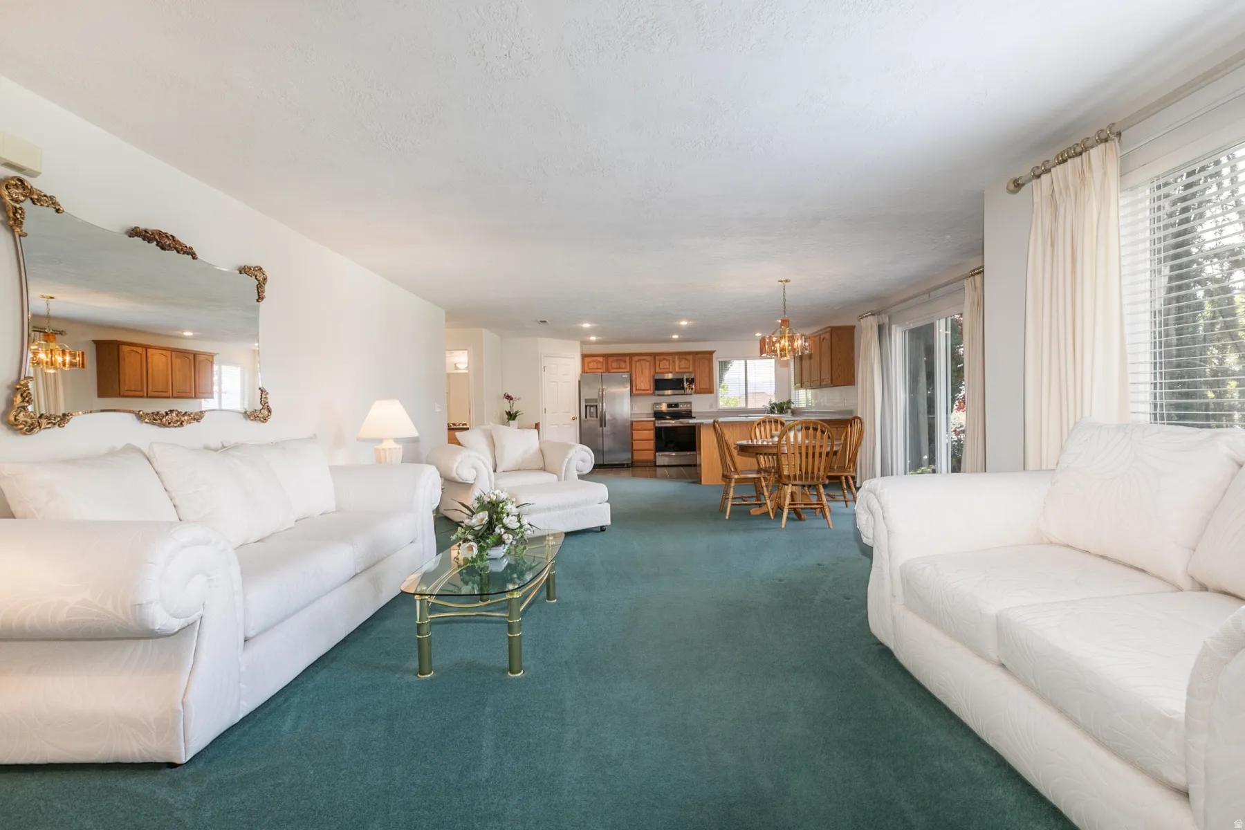 Family room and entry to in-law living space with walkout entry to yard and separate patio area.