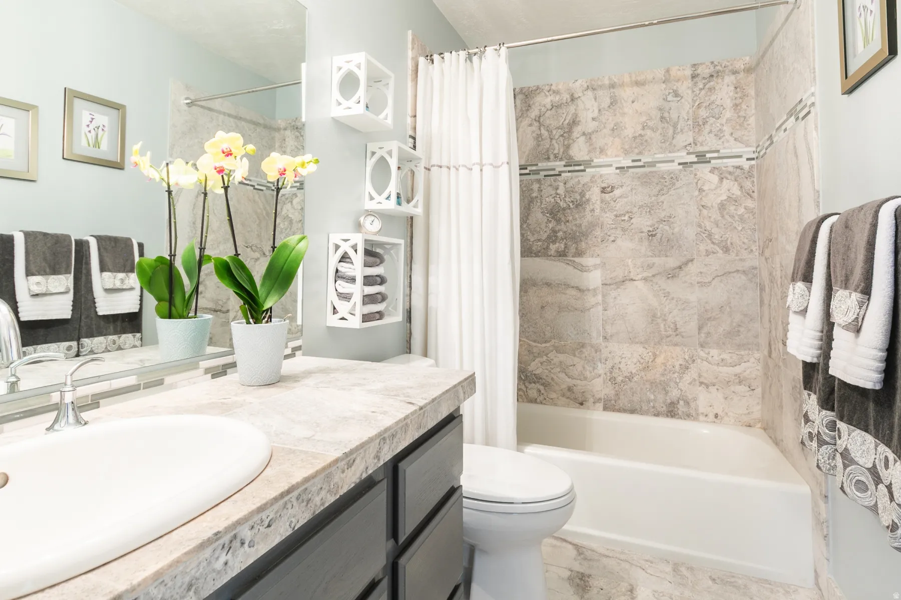 Bathroom featuring vanity and shower / tub combo