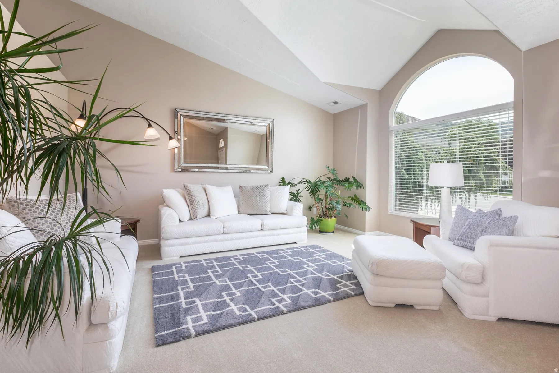 Formal living area with lofted ceiling.