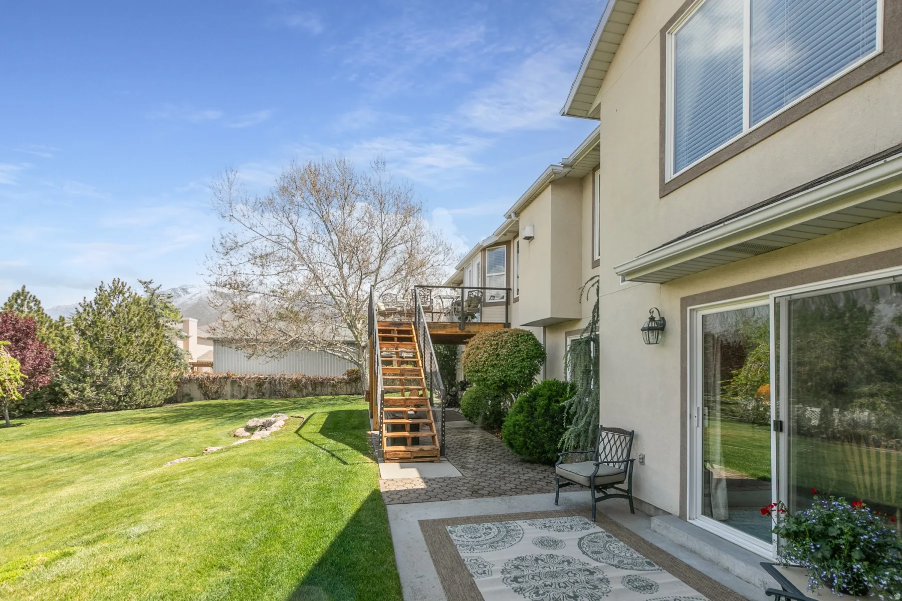 View of yard with a deck and a patio area