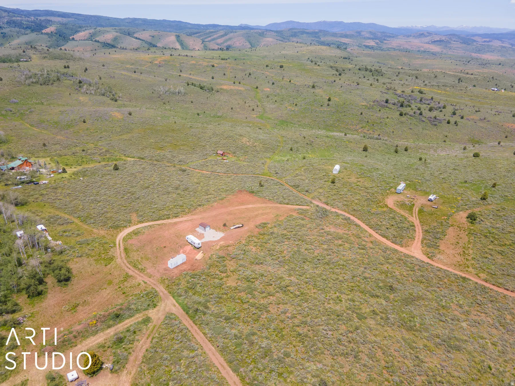 Overview of rural landscape featuring a mountain backdrop