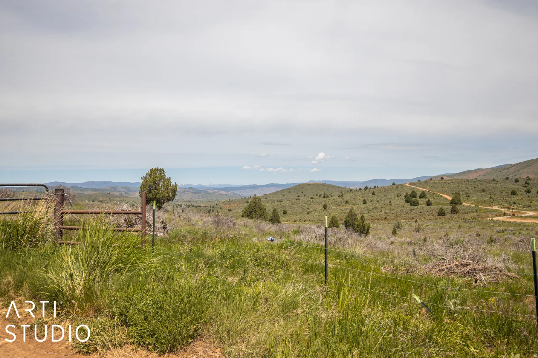 View of mountain backdrop featuring rural landscape