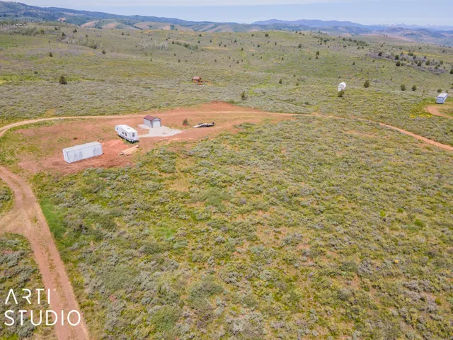 Aerial view of sparsely populated area featuring a mountainous background