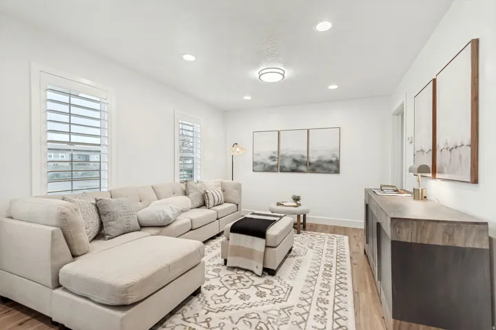 Living room featuring light wood-style floors and recessed lighting