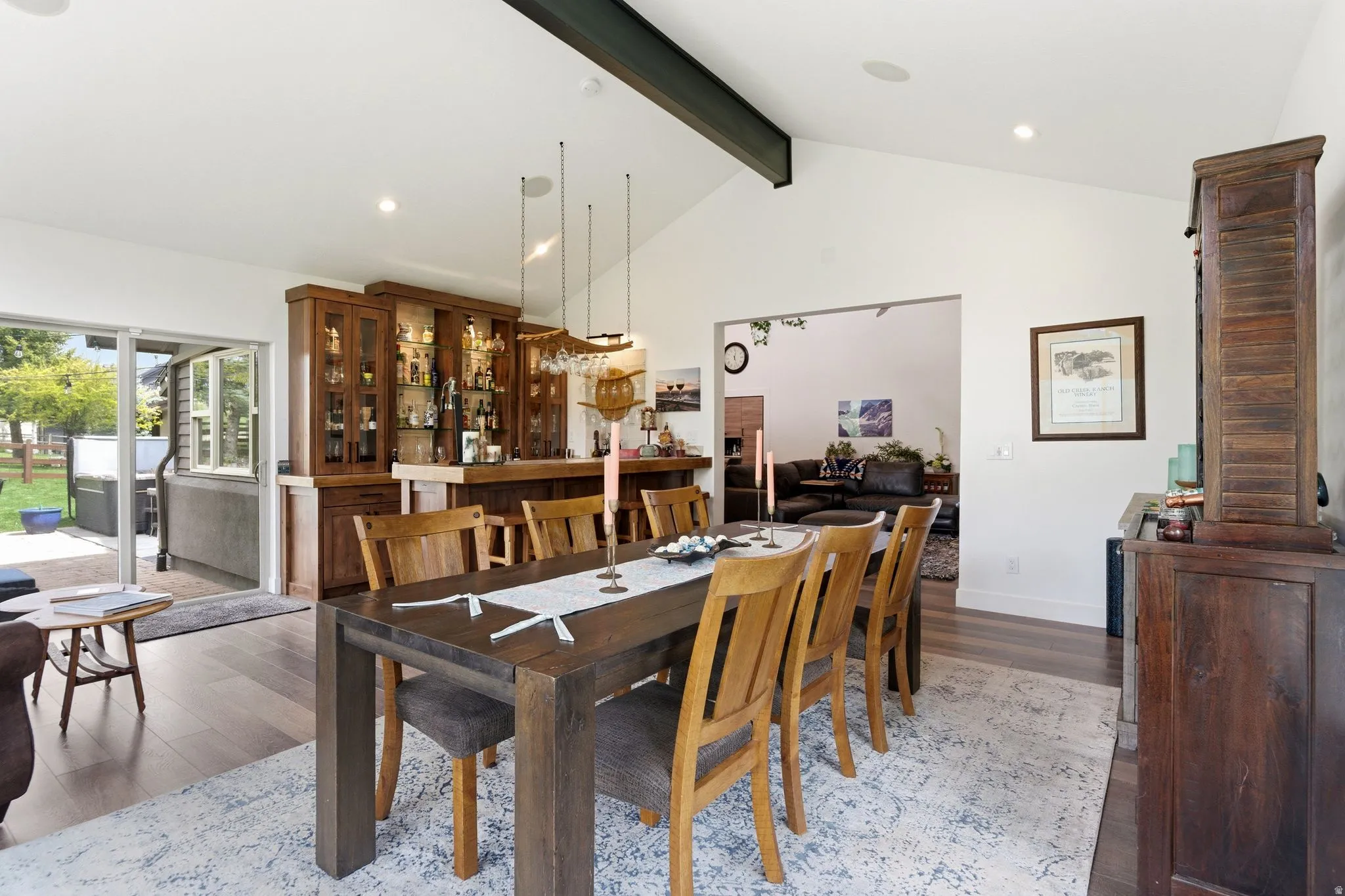 Dining area with wood finished floors and recessed lighting