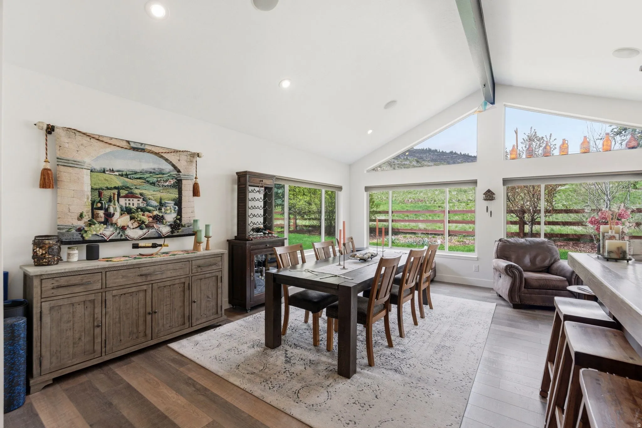 Dining room featuring dark wood finished floors, healthy amount of natural light, and recessed lighting