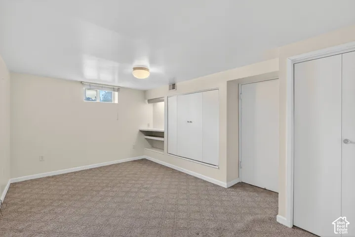 Below grade area with carpet and baseboards