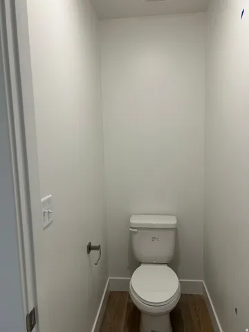Bathroom with dark wood-type flooring