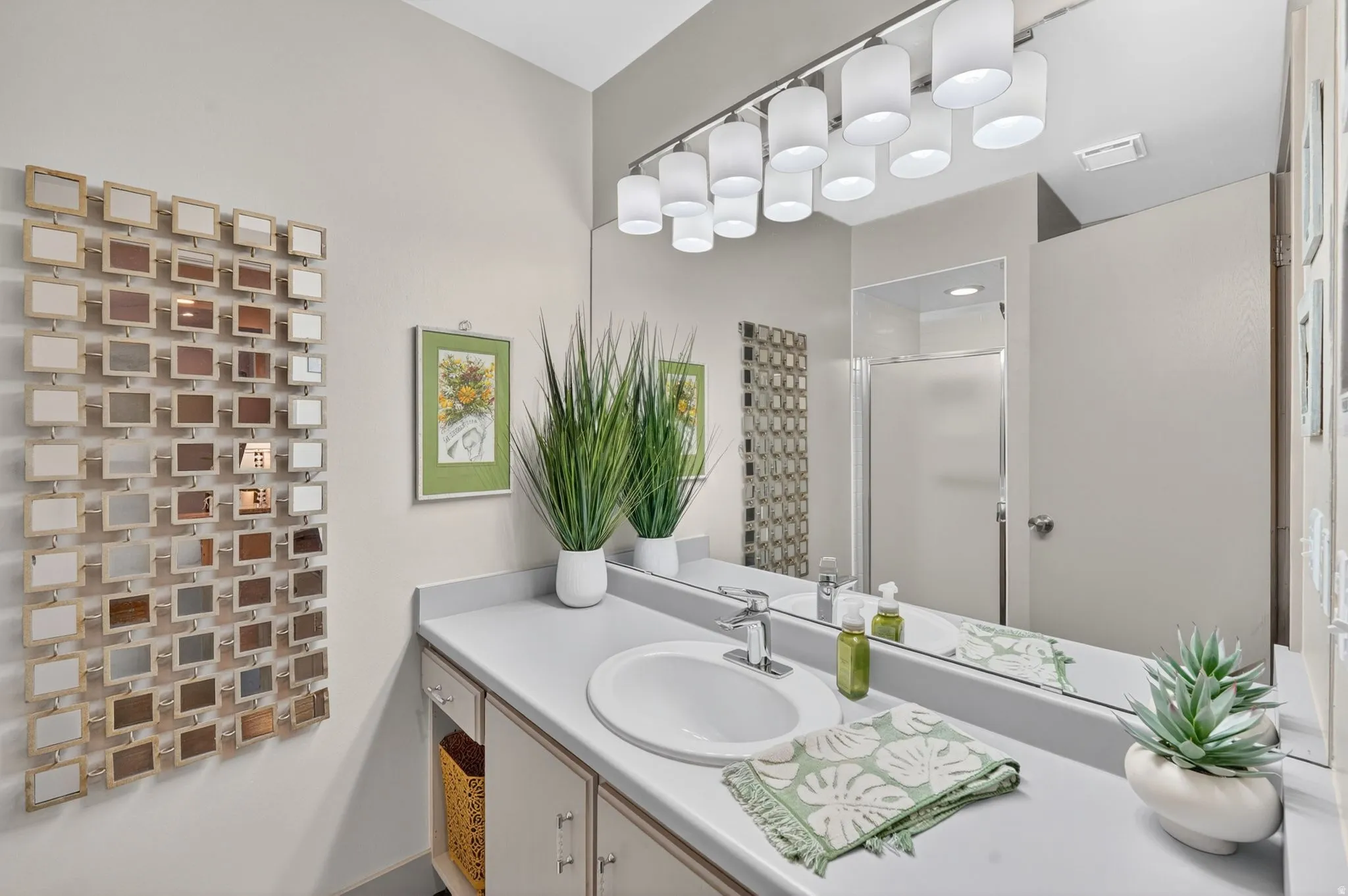 Bathroom with a stall shower and vanity