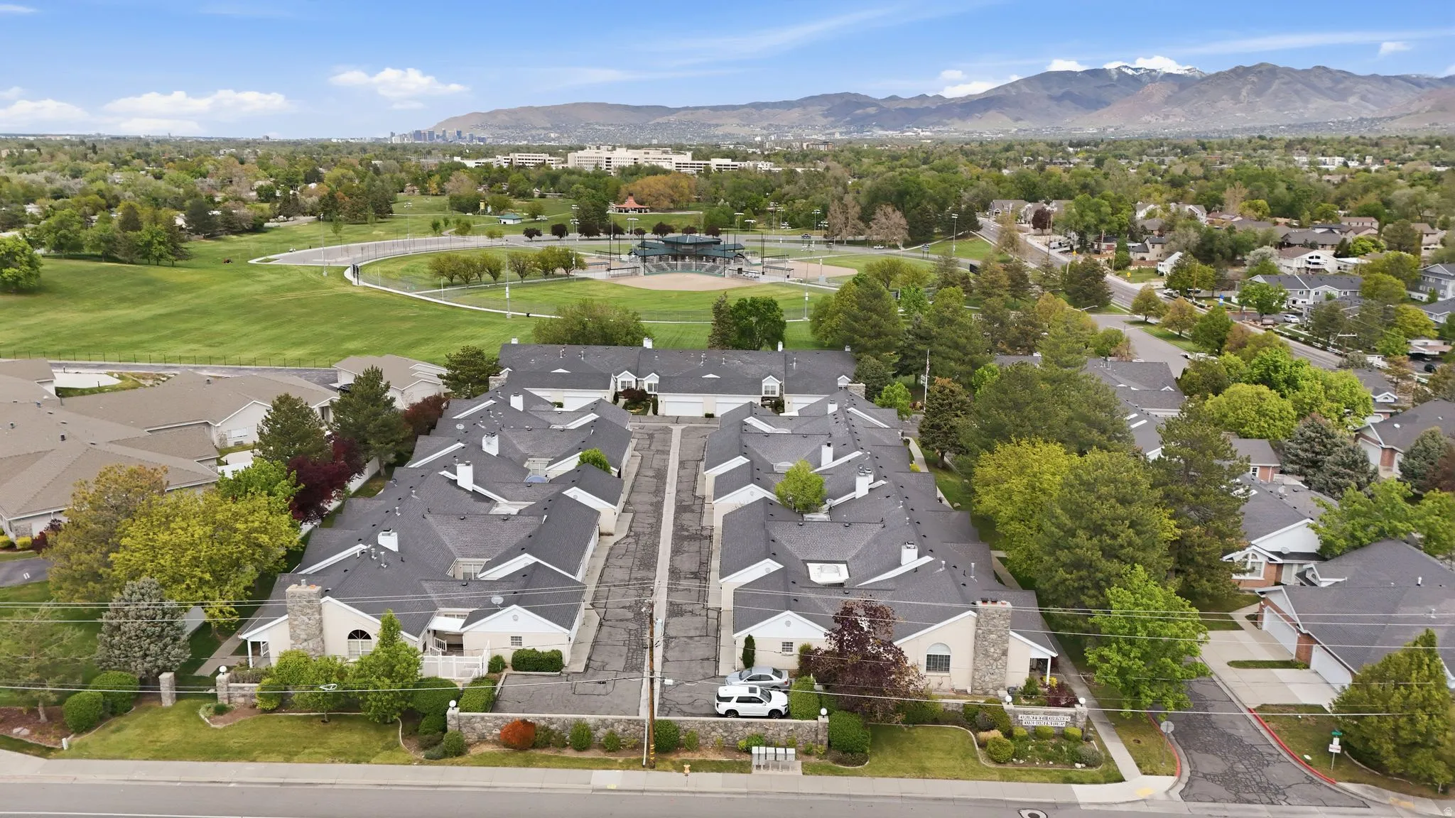 Aerial view of residential area featuring a mountainous background