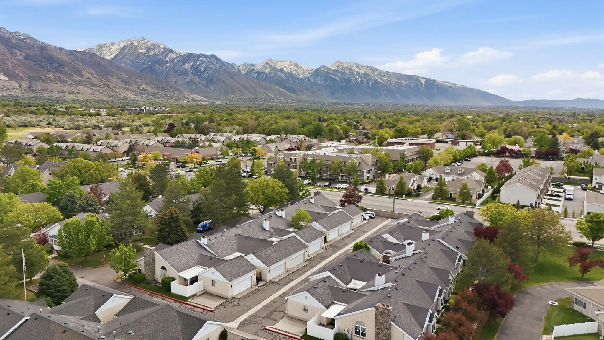 Aerial view of residential area featuring mountains