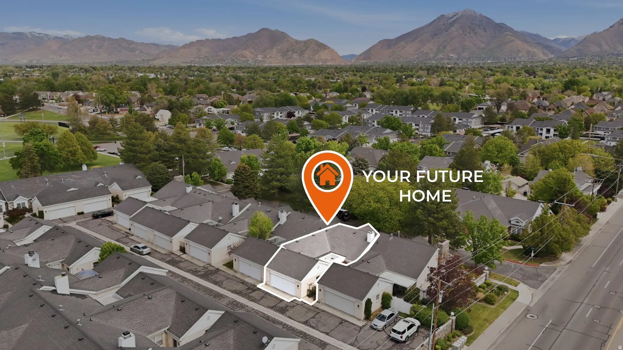 Aerial view of residential area with a mountain backdrop