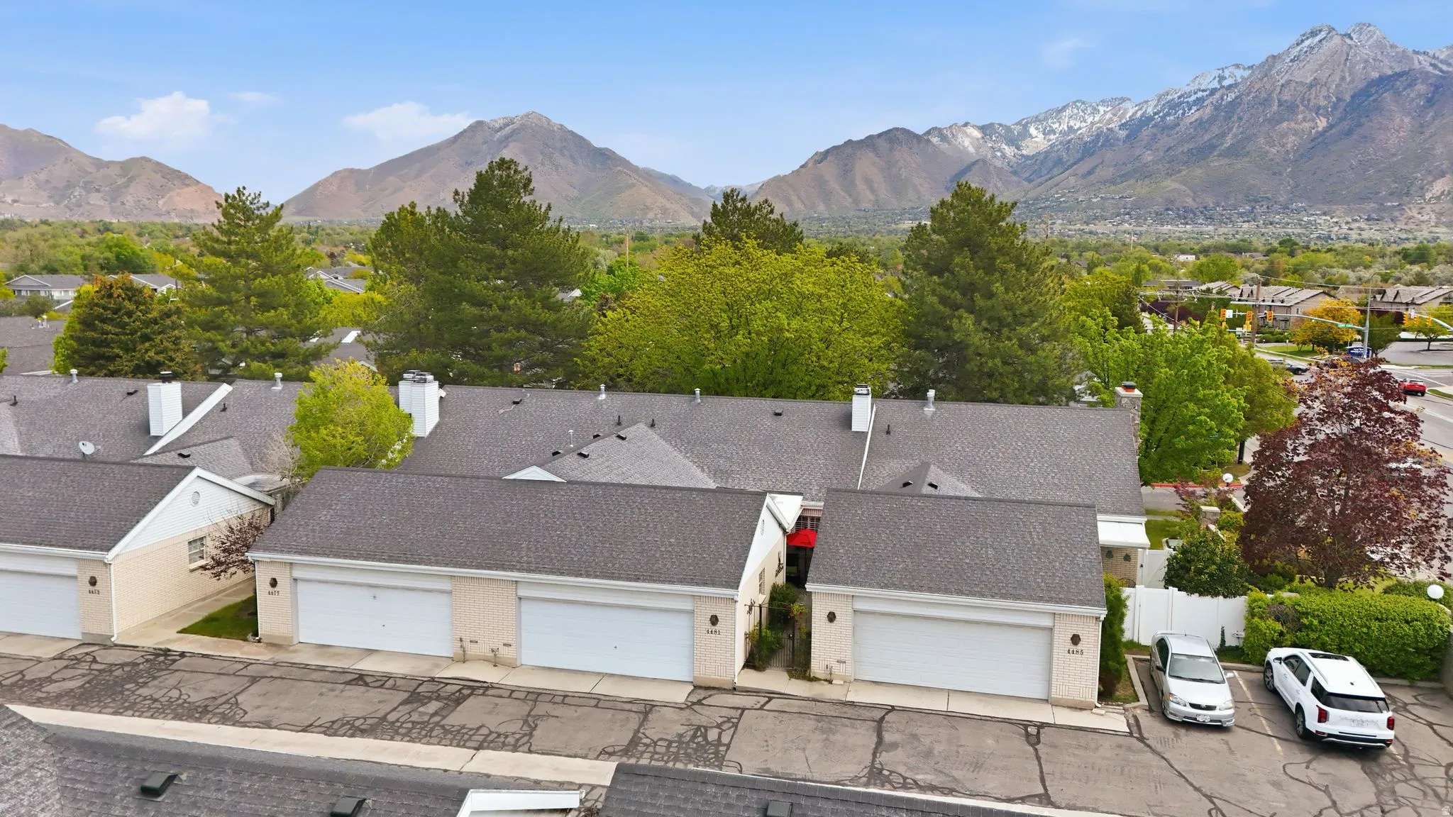 Aerial perspective of suburban area with a mountainous background