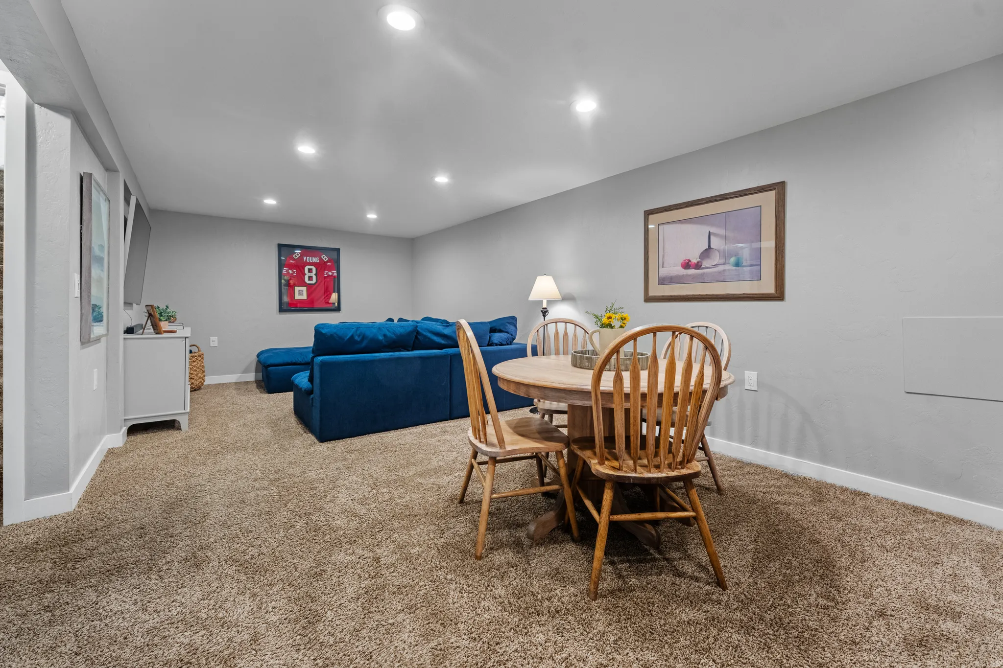 Carpeted dining area featuring baseboards and recessed lighting
