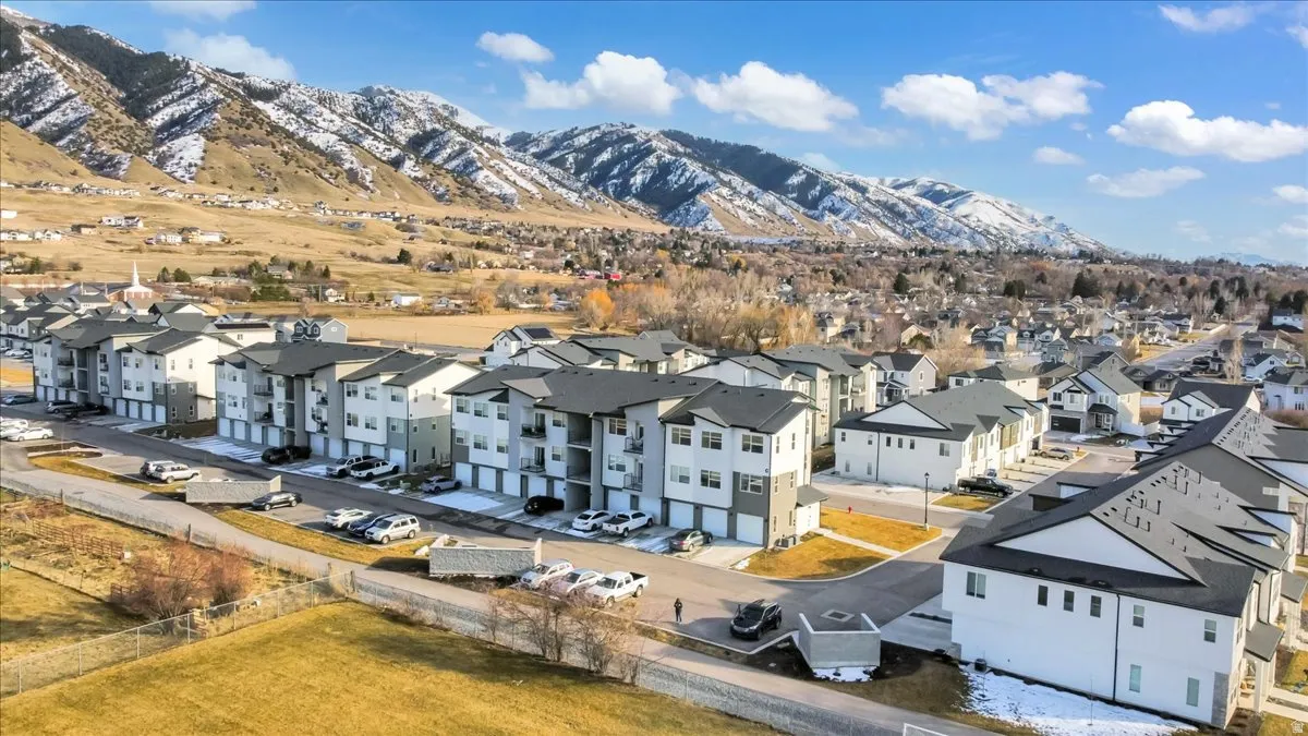 Aerial view of residential area featuring a mountain backdrop