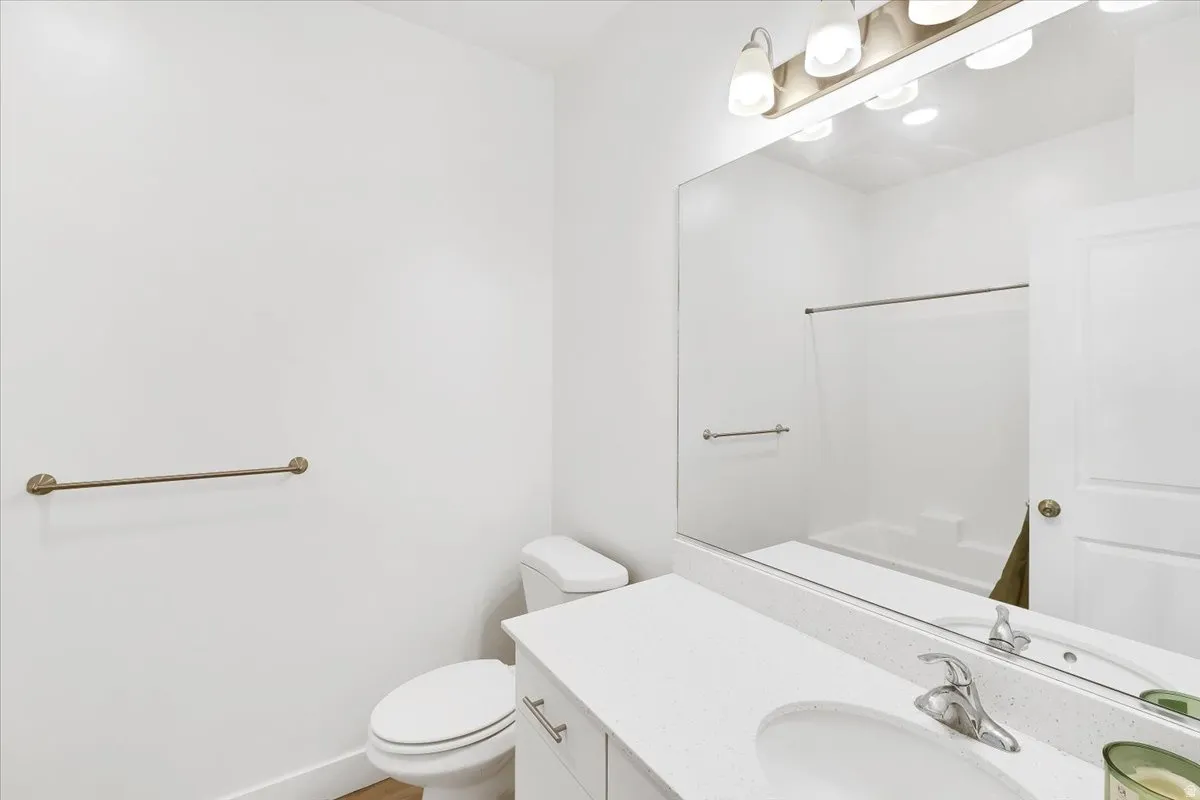 Full bathroom featuring vanity and toilet