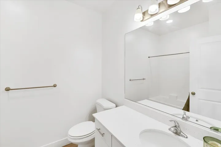 Full bathroom featuring vanity and toilet