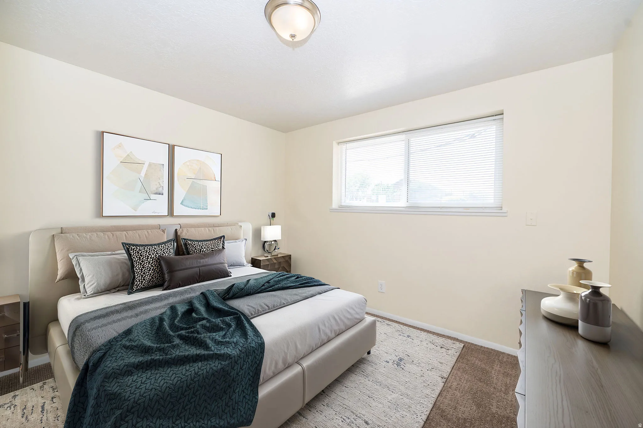 Bedroom featuring a single window with blinds, a ceiling-mounted light fixture, and light-toned walls