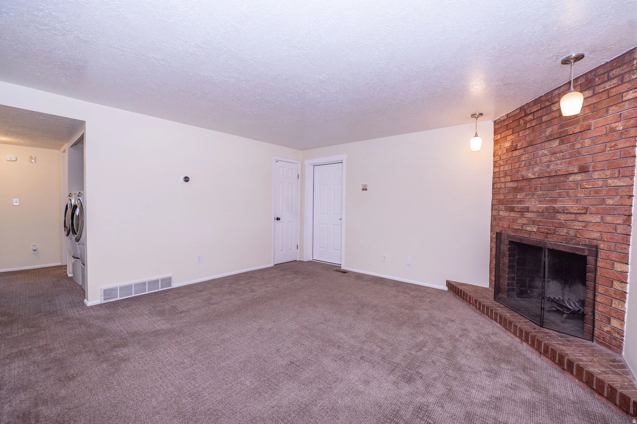 Corner brick fireplace with a raised hearth